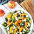 Grilled peach, blueberry and goat cheese arugula salad