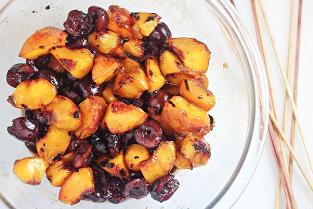 Grilled peaches and cherries with cinnamon-honey syrup