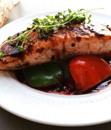 Grilled salmon and peppers with strawberry balsamic glaze