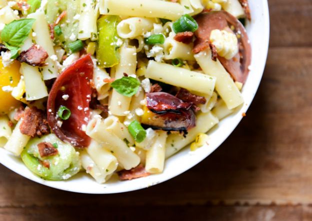 Smoky heirloom tomato and grilled peach pasta salad with basil vinaigrette