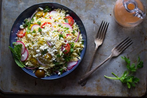 Herbed orzo pasta salad with tomatoes and feta