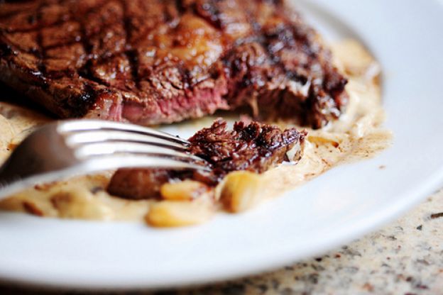 Grilled Ribeye Steak with Onion-Blue Cheese Sauce
