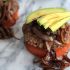 Paleo burgers with avocado and caramelized onions