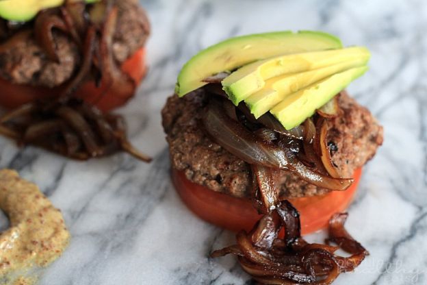 Paleo burgers with avocado and caramelized onions