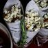 Popcorn with rosemary butter and honey-chipotle almonds