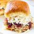Slow cooker pulled pork cranberry slaw sliders