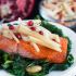 Roasted salmon with apple fennel salad over garlicky kale