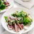 Seared ahi tuna with chimichurri sauce, arugula and avocado