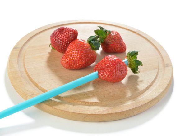 Hull strawberries with a straw