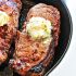 Skillet steaks with gorgonzola herbed butter