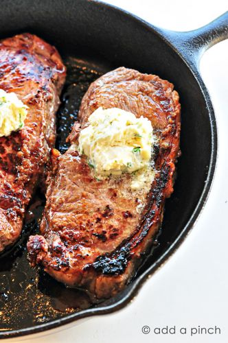 Skillet steaks with gorgonzola herbed butter