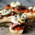 STEAK AND EGG BREAKFAST BRUSCHETTA WITH CRISPY KALE, GOAT CHEESE, AND ROASTED TOMATOES