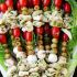 Tortellini skewers with olives, tomatoes and cheese
