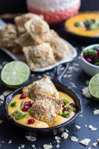 Tortilla chip crusted ravioli with spicy fontina queso fundido