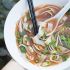 Vegan pho with baked ginger tofu