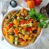 Colorful pasta salad with grilled peppers, capers and green olives