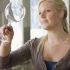 Holding a wine glass by the bowl