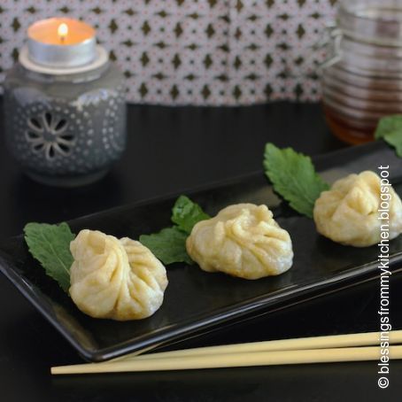 Momos with chili dipping sauce