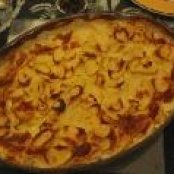 Potato gratin with bacon and ham