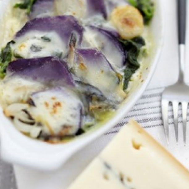 Blue potato and bacon gratin