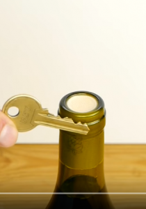 how to open a wine bottle with a key