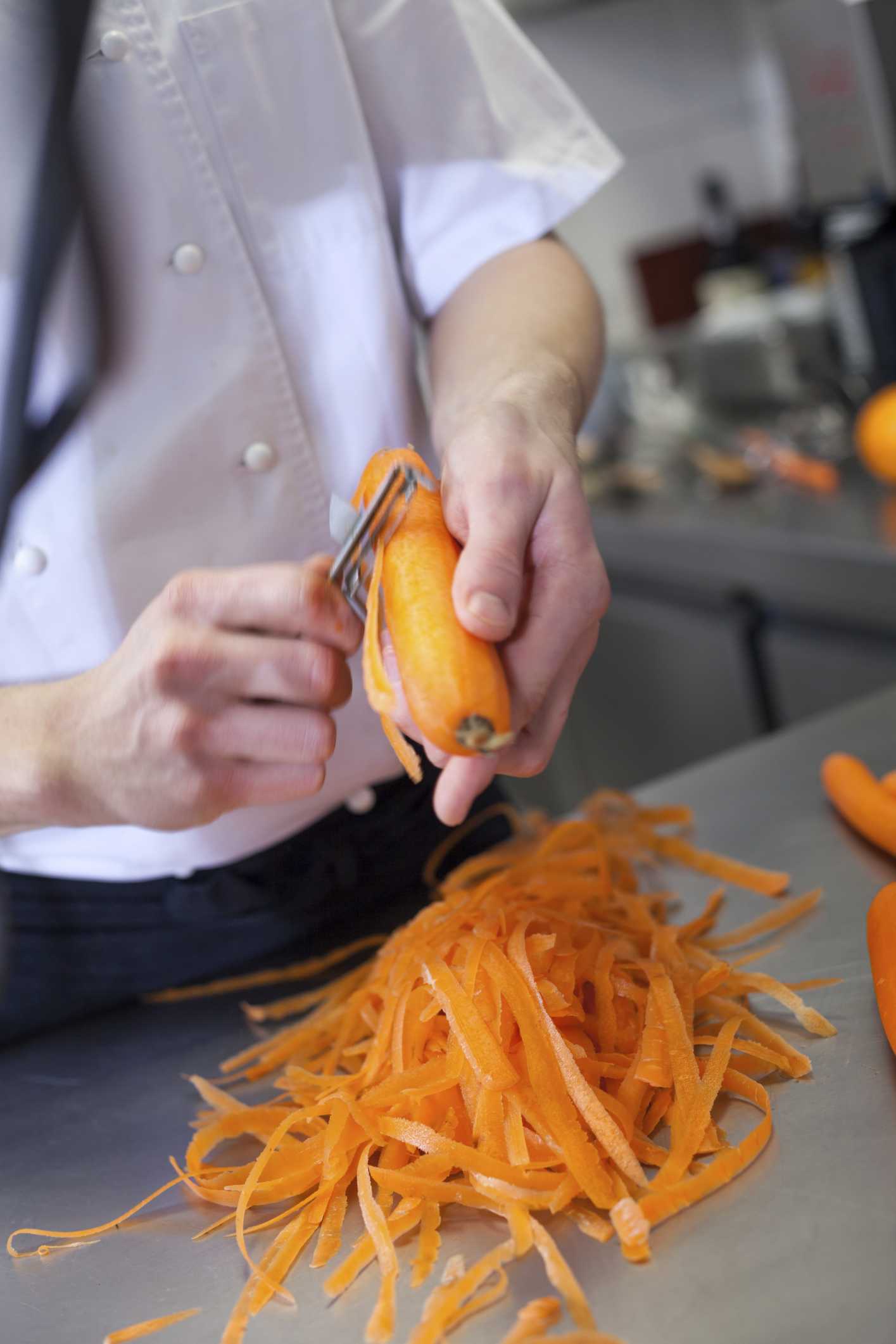 Man grating carrot